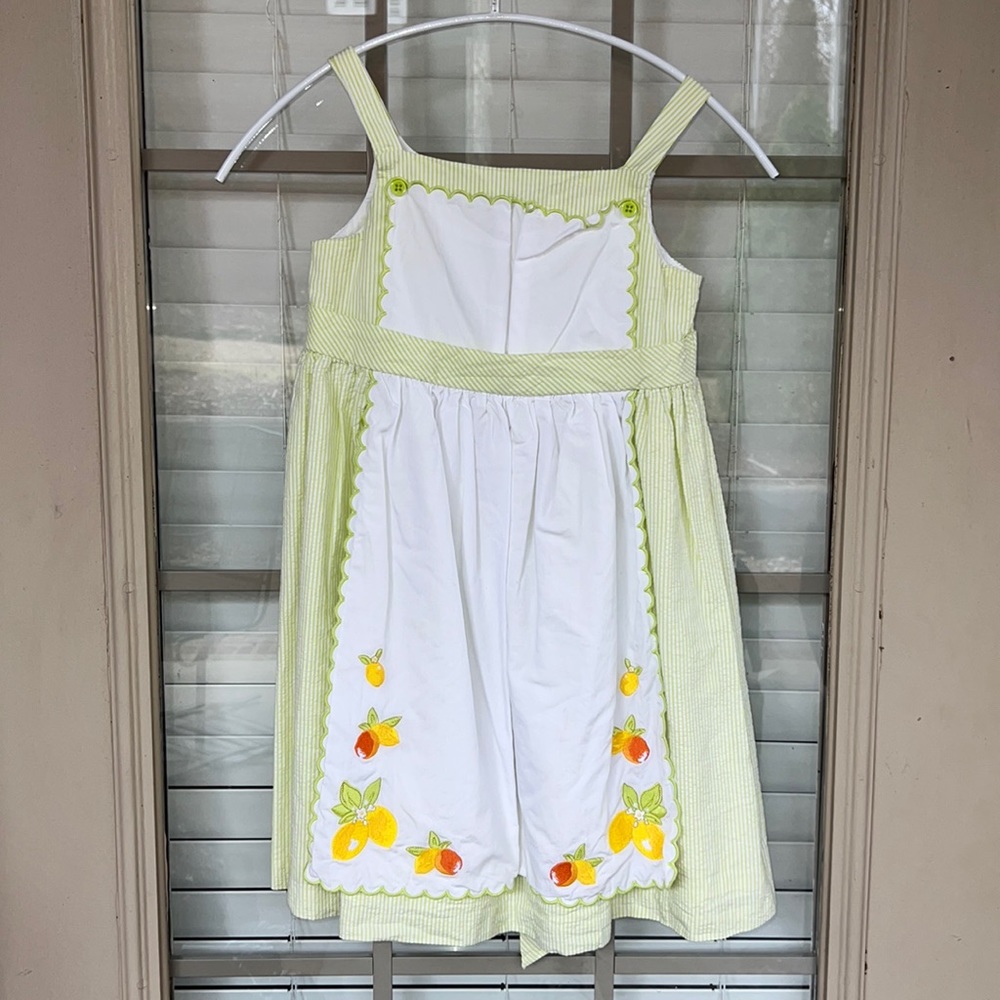 Janie and Jack size 5T.  This adorable dress is like green and white